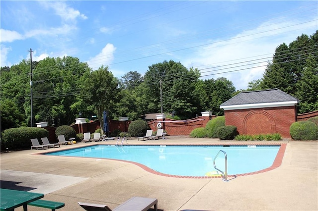 4011 Charrwood Trce, Marietta, GA 30062 - community pool featuring a patio area, fence, and an outdoor structure