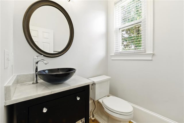4011 Charrwood Trce, Marietta, GA 30062 - half bathroom featuring toilet and vanity