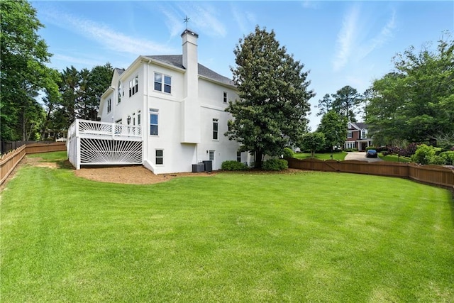 4011 Charrwood Trce, Marietta, GA 30062 - rear view of property with stucco siding, a deck, a chimney, and central AC