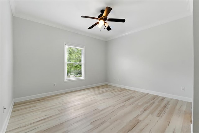 4011 Charrwood Trce, Marietta, GA 30062 - spare room featuring ornamental molding, baseboards, light wood-style flooring, and ceiling fan