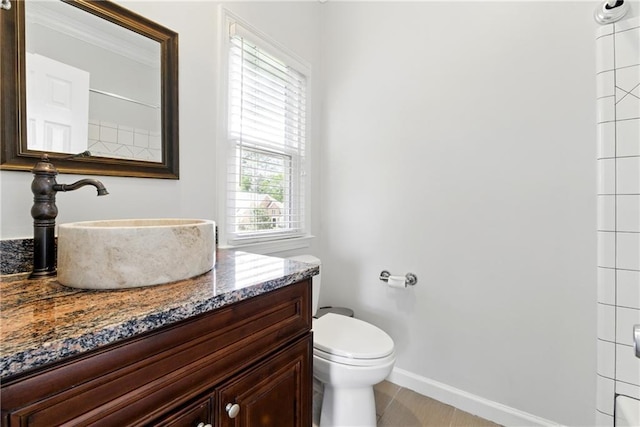 4011 Charrwood Trce, Marietta, GA 30062 - bathroom featuring toilet, vanity, and baseboards