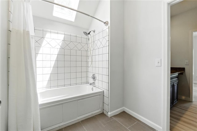 4011 Charrwood Trce, Marietta, GA 30062 - bathroom featuring shower / bath combination with curtain, baseboards, vanity, and a skylight