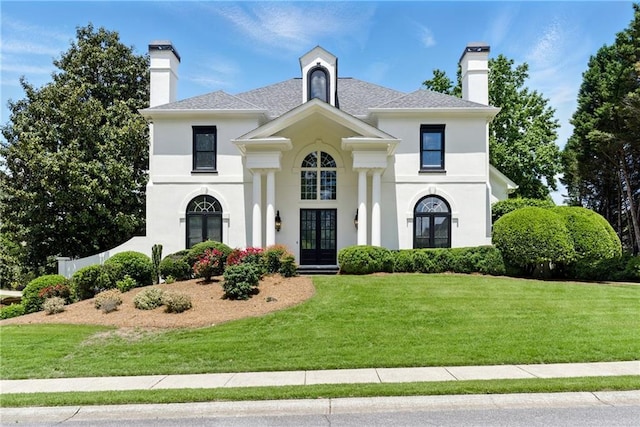 4011 Charrwood Trce, Marietta, GA 30062 - view of front of property featuring french doors, a front lawn, stucco siding, and a chimney