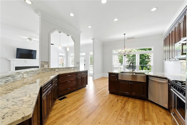 4011 Charrwood Trce, Marietta, GA 30062 - kitchen with a sink, appliances with stainless steel finishes, plenty of natural light, light wood-style floors, and recessed lighting