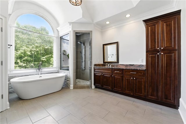4011 Charrwood Trce, Marietta, GA 30062 - full bath with healthy amount of natural light, vanity, a shower stall, a soaking tub, and crown molding