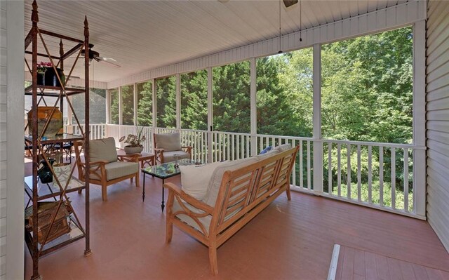 sunroom with ceiling fan and a wealth of natural light