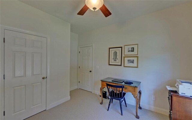 office space with ceiling fan and light colored carpet