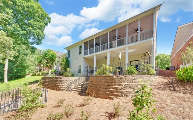 back of property with a balcony, ceiling fan, and central air condition unit