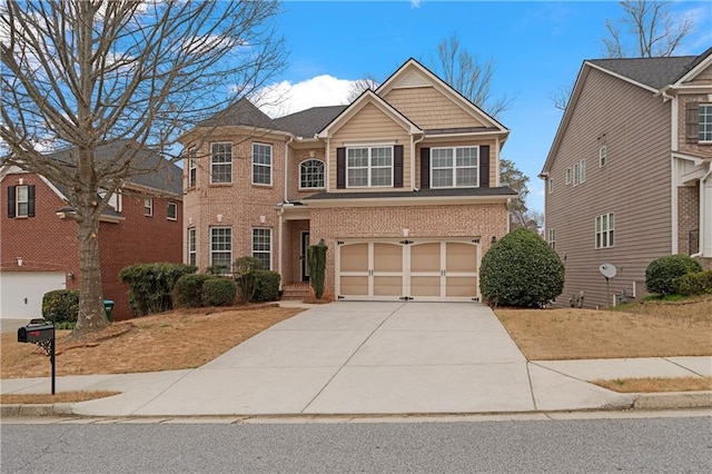 view of front of property with a garage, brick siding, and driveway