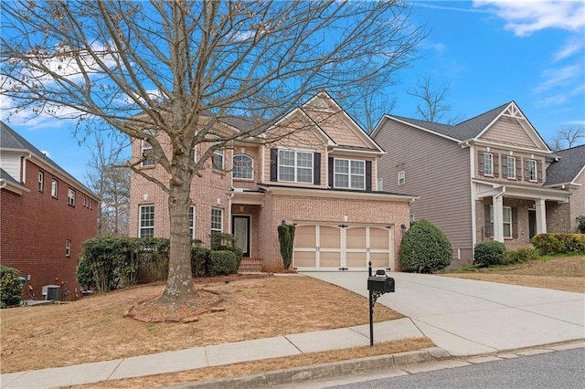 view of front of property with an attached garage, brick siding, central AC unit, and driveway