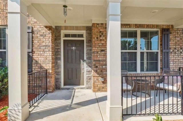 doorway to property with a porch