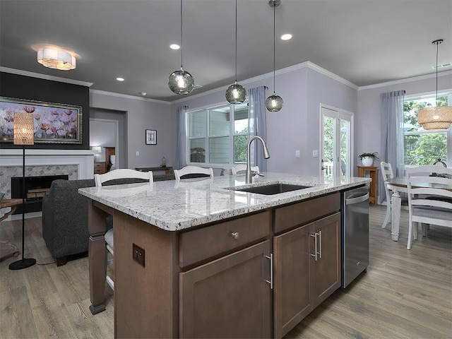 712 Broken Arrow, Waleska, GA 30183 - kitchen with dishwasher, light wood-type flooring, a fireplace, a kitchen breakfast bar, and crown molding