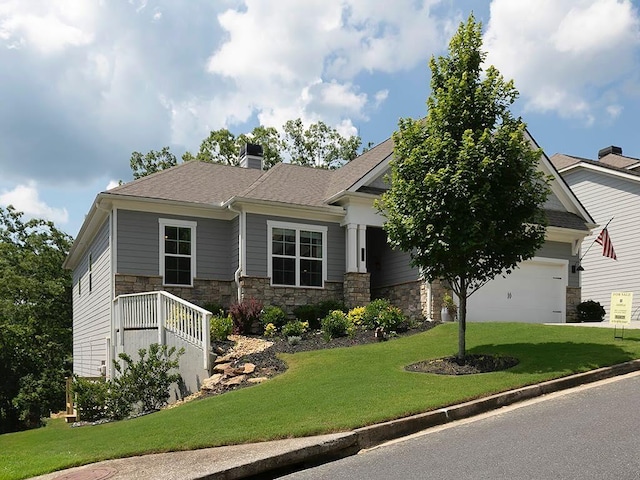 712 Broken Arrow, Waleska, GA 30183 - craftsman house with stone siding, a front yard, a chimney, an attached garage, and roof with shingles