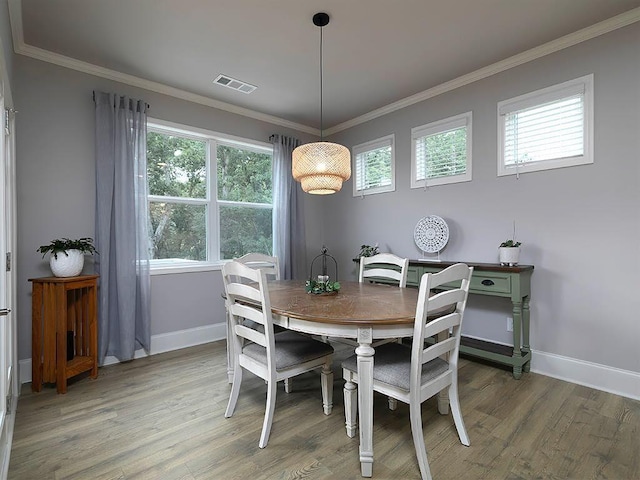 712 Broken Arrow, Waleska, GA 30183 - dining space with light wood-style flooring and crown molding