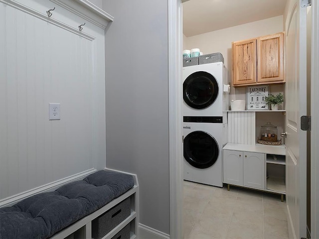 712 Broken Arrow, Waleska, GA 30183 - laundry area with estacked washer and dryer, light tile patterned floors, and cabinet space