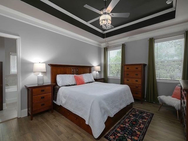 712 Broken Arrow, Waleska, GA 30183 - bedroom featuring a tray ceiling, ornamental molding, wood finished floors, and ensuite bathroom