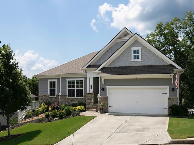 712 Broken Arrow, Waleska, GA 30183 - craftsman inspired home featuring driveway, a front yard, stone siding, a garage, and roof with shingles