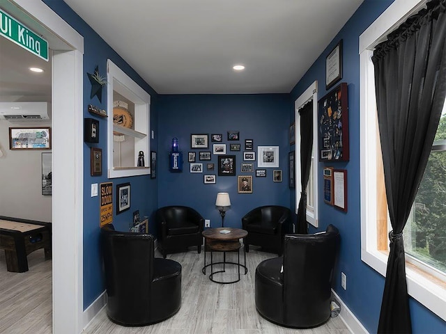712 Broken Arrow, Waleska, GA 30183 - living area with wood finished floors, an AC wall unit, and recessed lighting