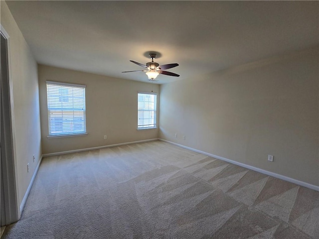 2104 Meadow Peak Rd, Duluth, GA 30097 - spare room featuring light carpet, baseboards, and a ceiling fan