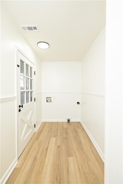 4336 Parkview Dr, Lithia Springs, GA 30122 - washroom featuring light wood-type flooring, visible vents, electric dryer hookup, laundry area, and washer hookup