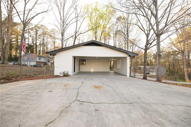 4336 Parkview Dr, Lithia Springs, GA 30122 - garage with an attached carport, aphalt driveway, and fence