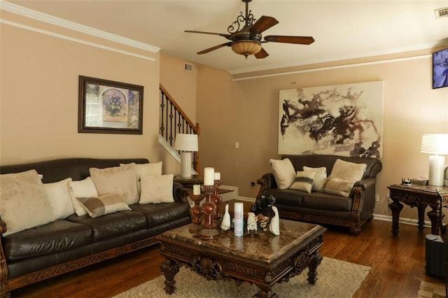 living room featuring crown molding, ceiling fan, and dark wood-type flooring