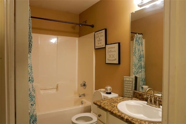 full bathroom featuring shower / bath combo with shower curtain, vanity, and toilet