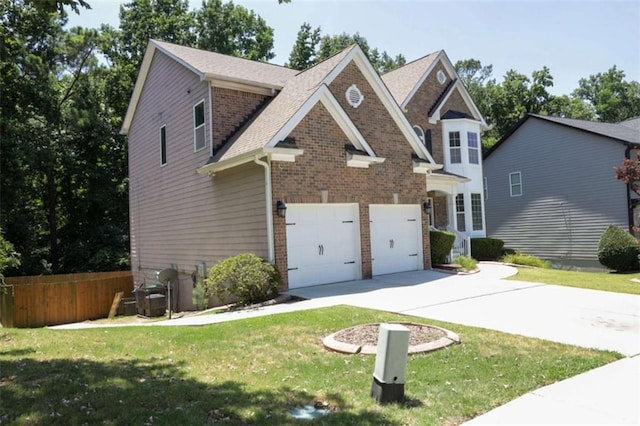 view of front of property with a garage and a front yard