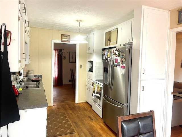 kitchen featuring sink, white range with electric cooktop, stainless steel refrigerator with ice dispenser, dark hardwood / wood-style flooring, and decorative light fixtures