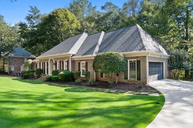 cape cod home with a garage and a front yard