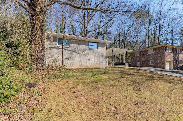 exterior space with a front yard and a carport