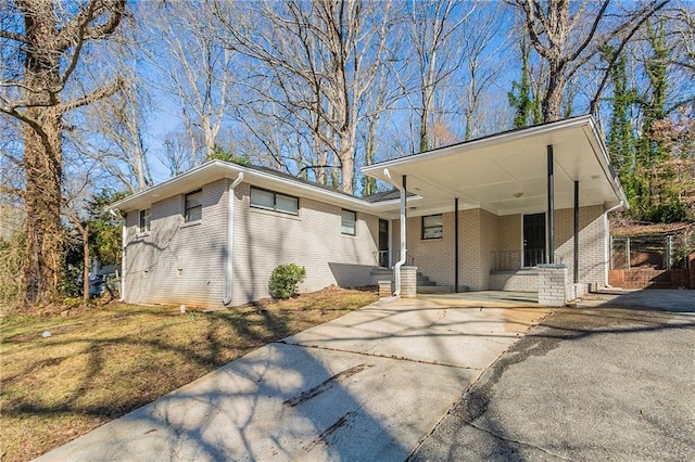 view of front of home with a carport