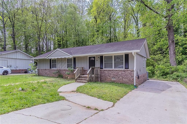 ranch-style home featuring a porch, brick siding, a front lawn, and crawl space