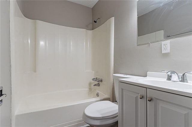 full bathroom with bathing tub / shower combination, toilet, a textured ceiling, and vanity