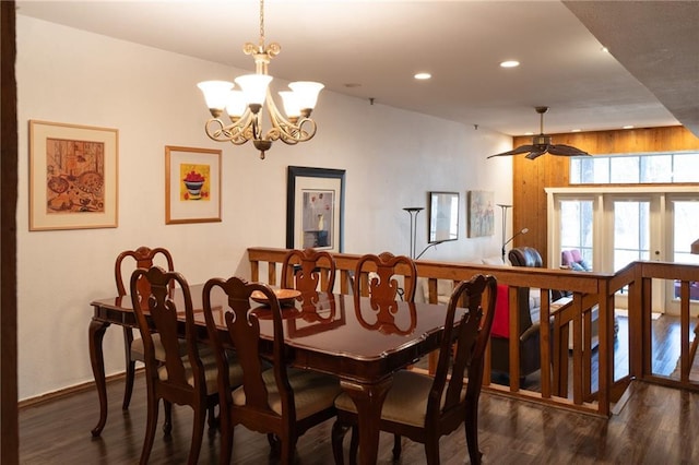 dining area featuring dark wood-type flooring and a chandelier