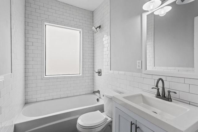 bathroom with tile walls, shower / bath combination, decorative backsplash, toilet, and vanity