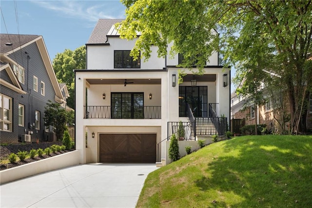 555 Orme Cir NE, Atlanta, GA 30306 - modern home with stucco siding, driveway, a front lawn, and a garage