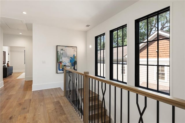 555 Orme Cir NE, Atlanta, GA 30306 - corridor featuring attic access, baseboards, light wood-style floors, recessed lighting, and an upstairs landing