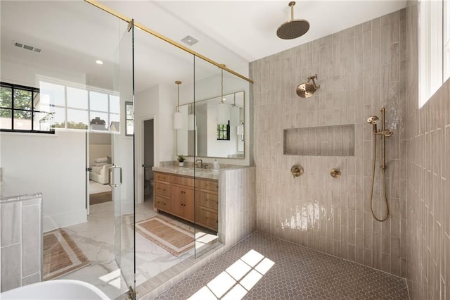 555 Orme Cir NE, Atlanta, GA 30306 - full bathroom featuring a tile shower, vanity, and marble finish flooring