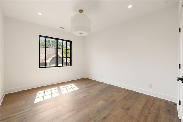 555 Orme Cir NE, Atlanta, GA 30306 - empty room with wood finished floors, baseboards, and recessed lighting