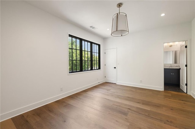555 Orme Cir NE, Atlanta, GA 30306 - unfurnished room featuring baseboards, wood finished floors, a sink, and recessed lighting