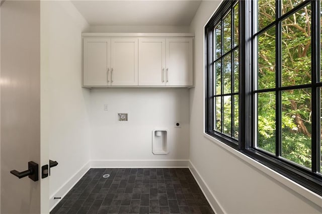 555 Orme Cir NE, Atlanta, GA 30306 - laundry room with cabinet space, electric dryer hookup, baseboards, and plenty of natural light