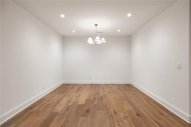 555 Orme Cir NE, Atlanta, GA 30306 - empty room with a chandelier, recessed lighting, light wood finished floors, and baseboards