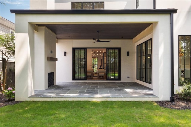 555 Orme Cir NE, Atlanta, GA 30306 - rear view of property featuring stucco siding, ceiling fan, and a patio
