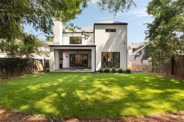 555 Orme Cir NE, Atlanta, GA 30306 - rear view of house featuring stucco siding, a patio area, a chimney, and ceiling fan