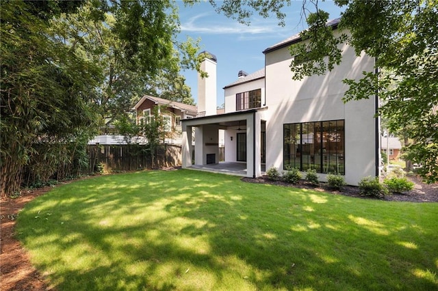 555 Orme Cir NE, Atlanta, GA 30306 - back of property with stucco siding, a patio area, and a chimney