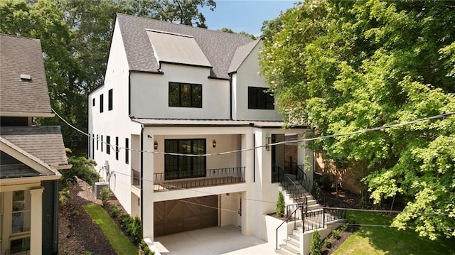 555 Orme Cir NE, Atlanta, GA 30306 - view of front of home featuring stucco siding, roof with shingles, stairs, metal roof, and a standing seam roof