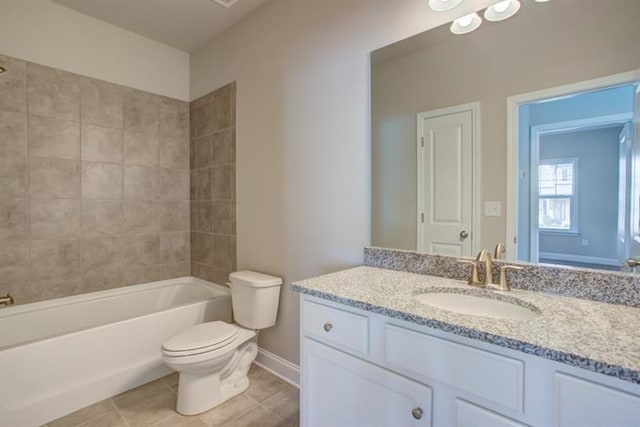 full bath featuring tile patterned floors, toilet, vanity, baseboards, and shower / bathtub combination