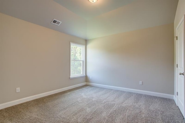 empty room with visible vents, carpet flooring, and baseboards