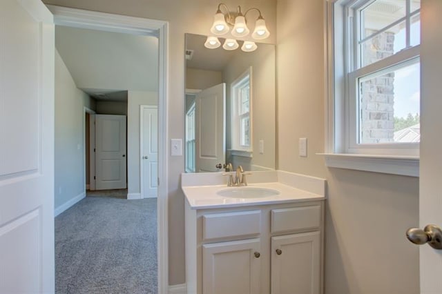 bathroom with vanity and baseboards